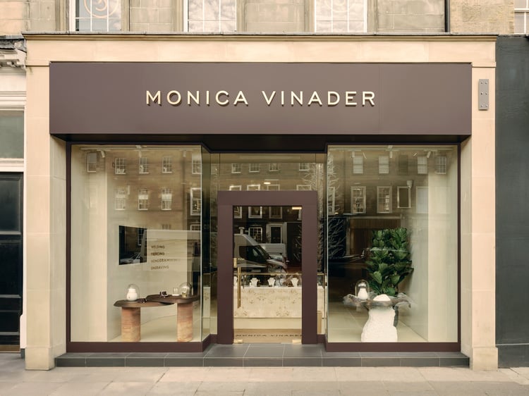 A picture of the Edinburgh storefront, with our trademark deep purple signage over the glass doors.